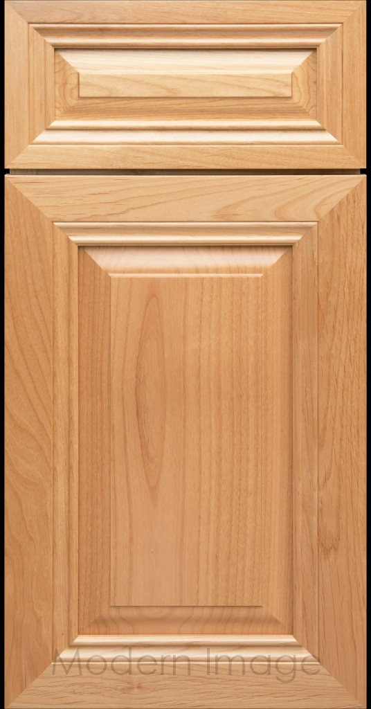 Close-up of a Natural-stained wood cabinet door with a mitered frame and traditional Cambridge raised center panel.